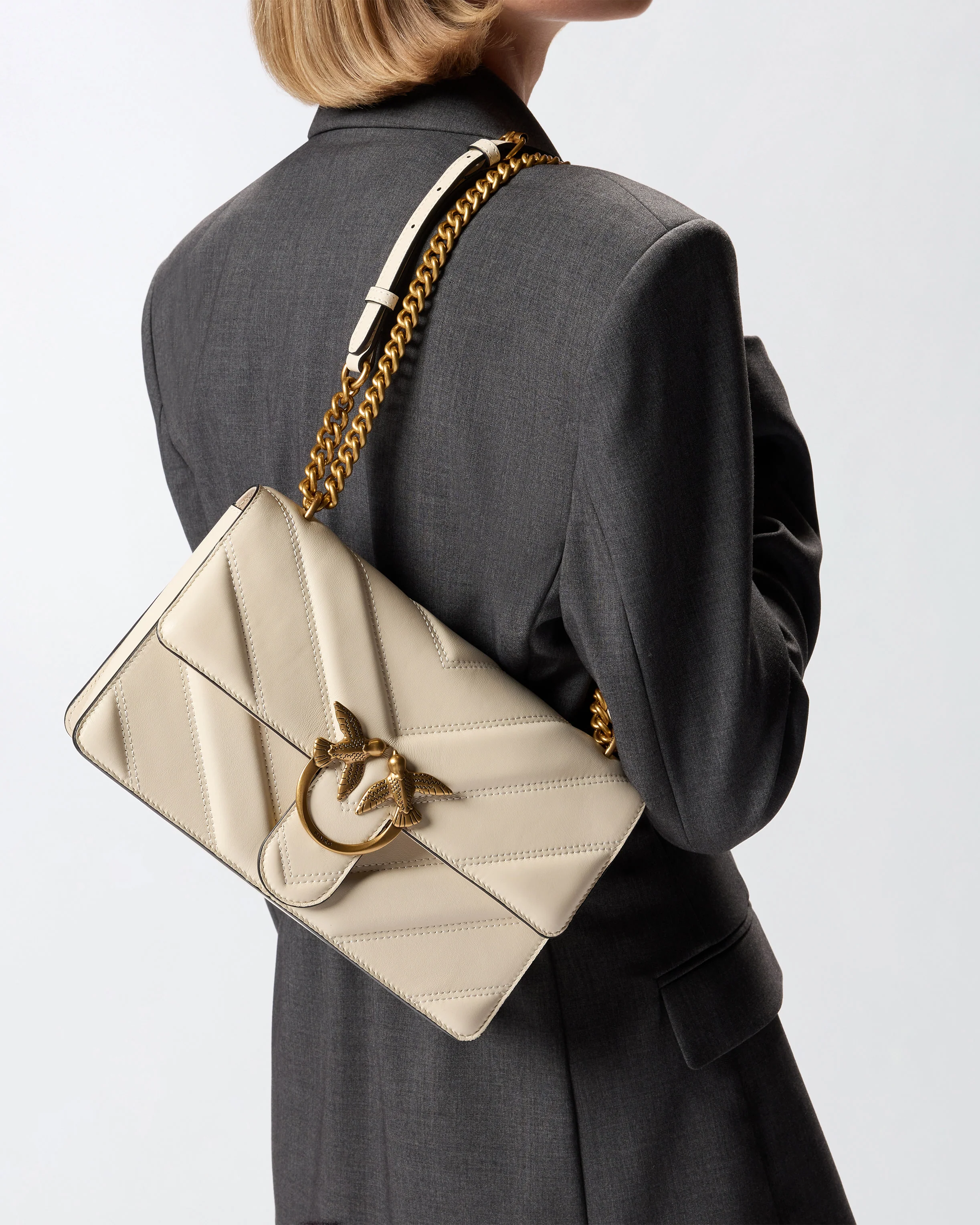 Medium Love Bag pebbled leather crossbody bag with V-shaped pattern and logo - Image 6